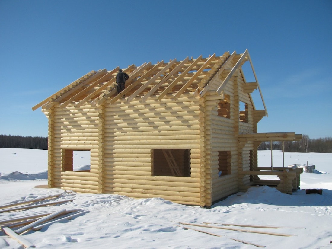 Wooden houses constructions from winter timber