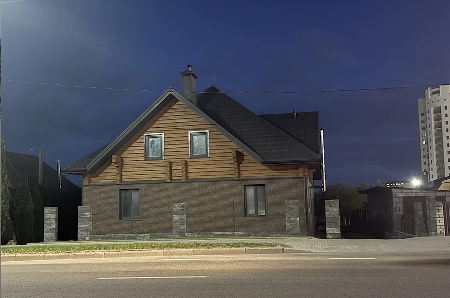 Mixed house: stone first floor and wooden second level   